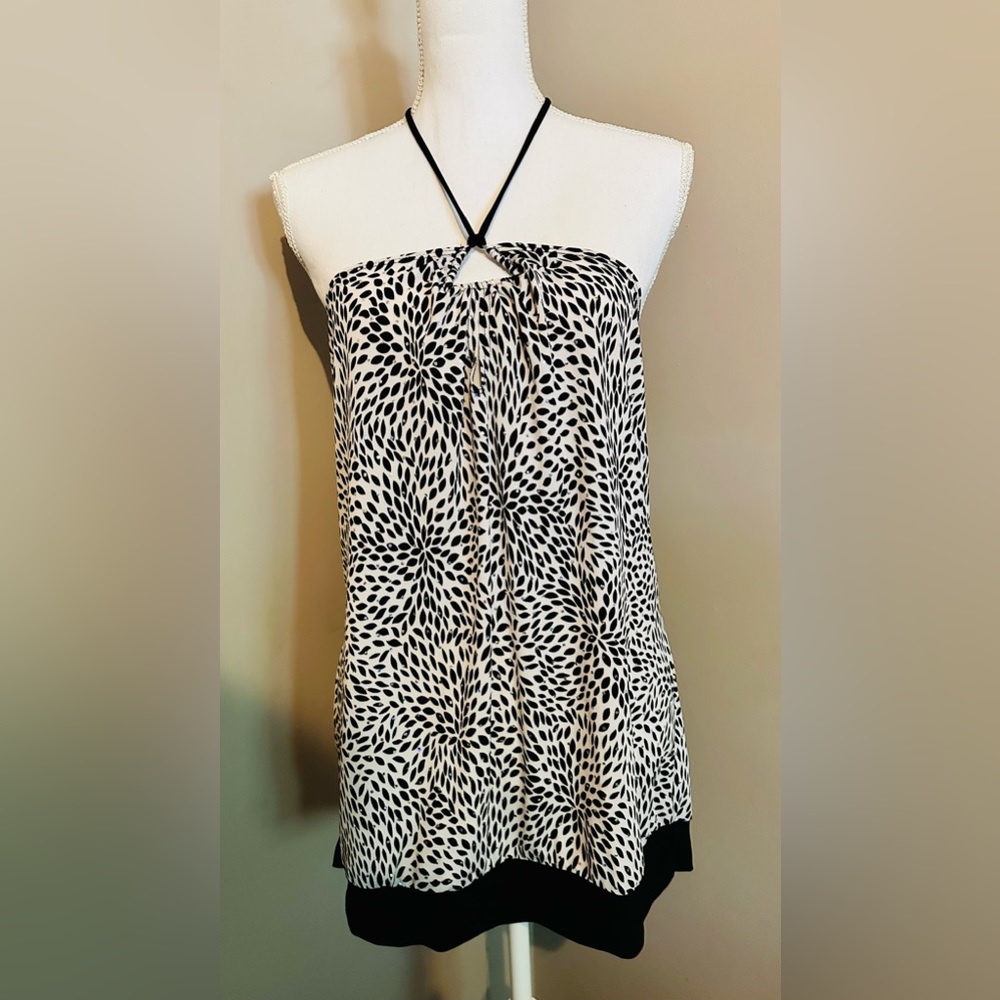 Simple halter top with tie at neck- white with black decor and black bottom hem.